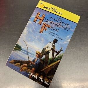 The Adventures of Huckleberry Finn by: Mark Twain, paperback book